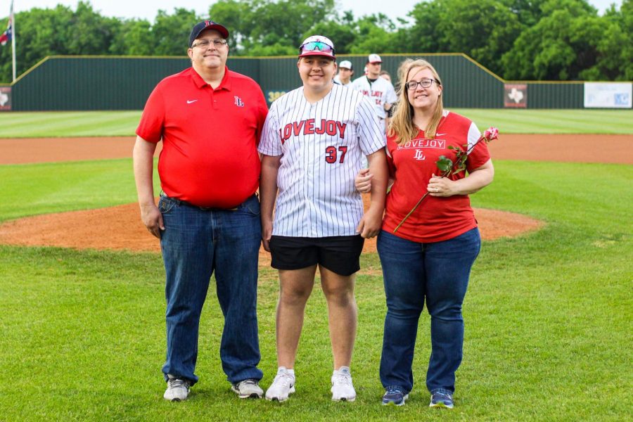 Senior catcher no. 37 Matthew Noack poses for a photo with his mom and dad for senior night. The team had 11 seniors recognized including two trainers. 