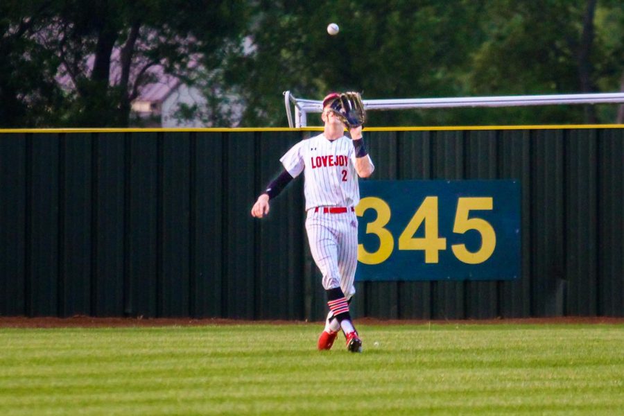 Junior left fielder no. 2 Trent Rucker catches a pop fly by Denison’s two hole hitter senior no 2. Logan Tilly. The catch put two away for the Leopards in the top of the first. 