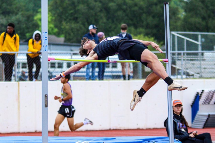 Freshman high jumper Colston Adamson glides over the high jump bar. Adamson finished with a clearing height of 6’2”, there was a jump off for fourth through sixth place as none of the competitors could clear 6’4”.