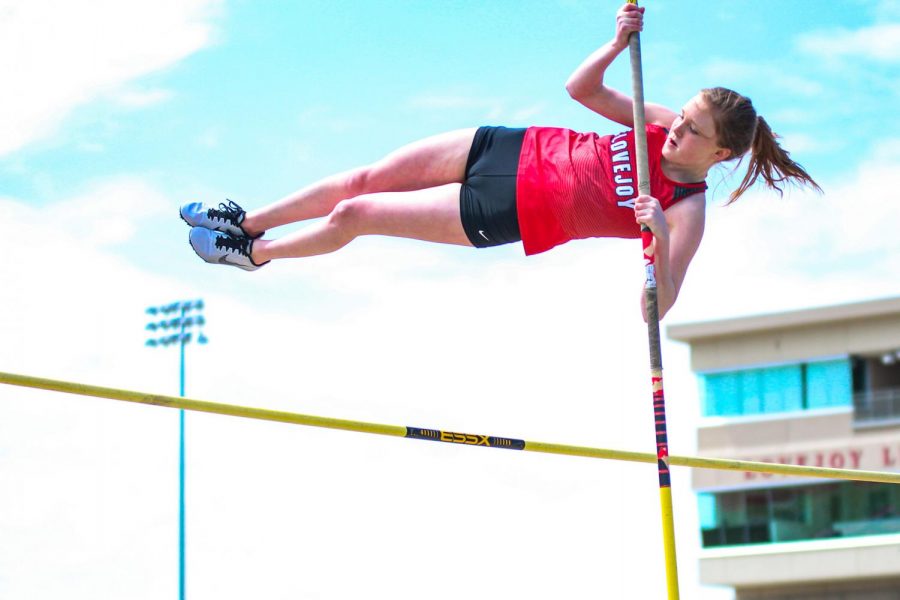 Freshman pole vaulter Brinley Ludlow flies over the vaulting bar. Ludlow was named JV girl’s pole vaulting district champion after clearing 8’1”.
