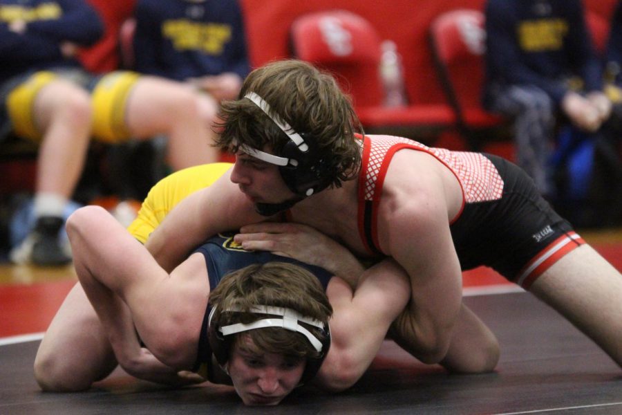 Senior wrestler Dalton Braun takes down his opponent. The wrestling team went to state this season, with one wrestler, senior Jakob Underwood, becoming a state champion.   