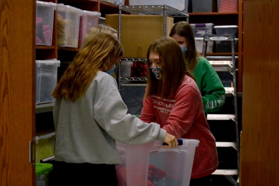 Majestic officers junior Gina Peoples and senior Alexa Barajas organize costumes. The Majestics will be performing their annual spring show this weekend. 