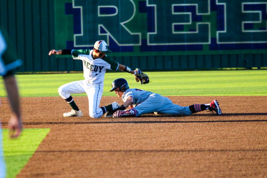 Junior shortstop no. 6 Kolby Branch safely dives under the tag of Reedy’s shortstop. Branch’s steal turned into the Leopard’s first run after being knocked in by sophomore center fielder no. 13 Aidan Smith.
