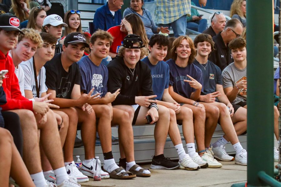 Members of the Jungle that came out to support the Leopards in game one at Mckinney North on Thursday night pose for a photo. The team won the first game 6-0 and the second game 5-4 to advance to the fourth round. 
