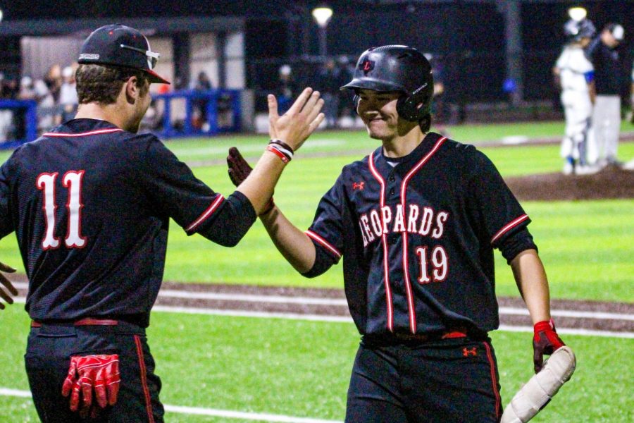 Junior catcher no. 19 Michael Holden celebrates with junior outfielder Ian Warren after Holden was walked by Rockhill’s senior reliever no. 32 Brenner Cox after being put into pinch hit for sophomore designated hitter Same Finn. The game went into eleven innings, four more than the normal seven inning game. 

