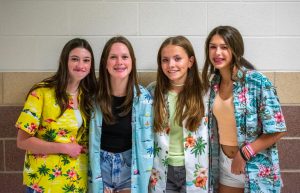 Freshmen Emma Tomlin, Brooke Striplin,  Finley Horton, and Emily Allen dressed up for Bikers vs. Surfers day. They all chose to dress up as surfers with Hawaiian shirts.