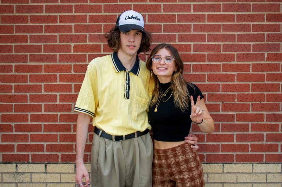 Juniors Tallon Finner and Mackenzie Lang pose together in theirs 70s outfits. Lang chose to dress in the 70s style while Finner dressed like a 70-year-old man.