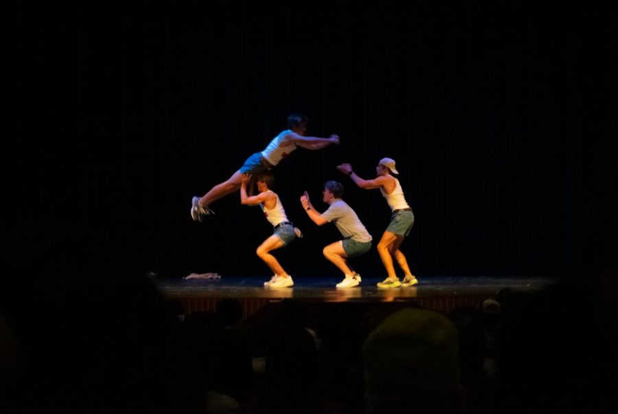 As senior Connor Dunn flies through the air, seniors Grant Collyer, Ian York, and Jake Piccirillo prepare to catch him. This catch was part of their dance routine.