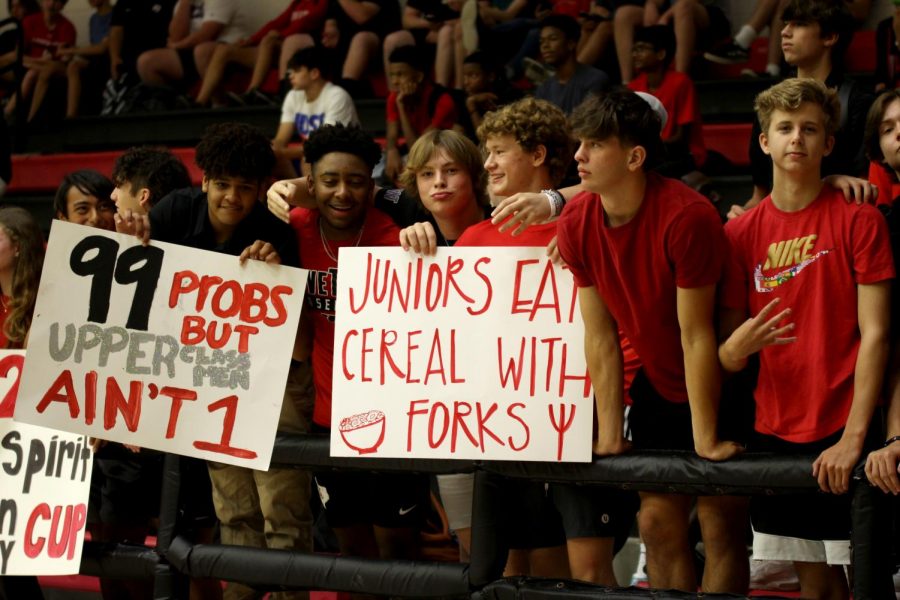 Sophomores Dante Dean, Aaron Marshall, Mason Dragoo, Ben Muirhead, Chase Bogle, and Hunter Hayward hold up signs against the junior team. The sophomores beat the juniors. 