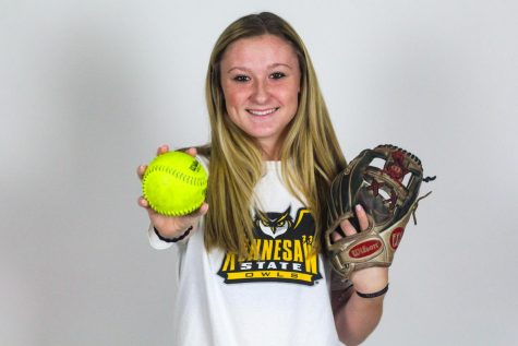 Junior Hannah Harvey holds out a softball. Harvey committed to Kennesaw State University on September 26th.