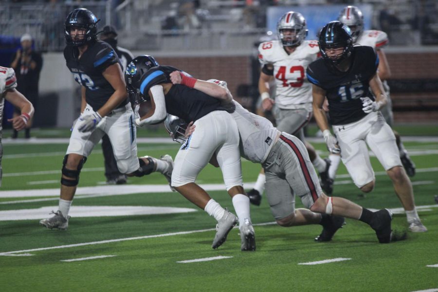 Junior linebacker no. 44 Bennett Slaughter tackles a Rock Hill running back. The Leopards beat the Blue Hawks with a final score of 55-14.