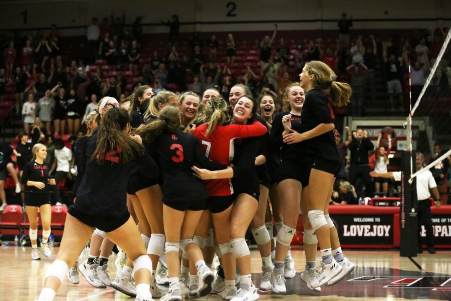 The volleyball team celebrates after winning the fifth set against the McKinney North Bulldogs. The game was the last home game this season for the team.