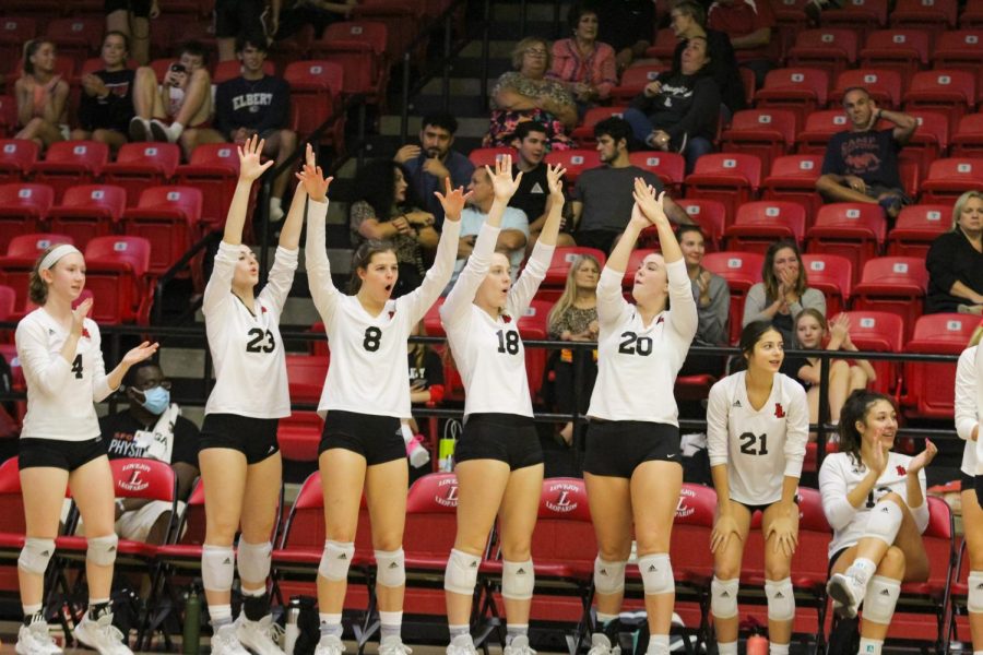 The Leopards celebrate as senior outside hitter no. 6 Avery Villareal hits the ball. The Leopards are co-district champions with McKinney North.