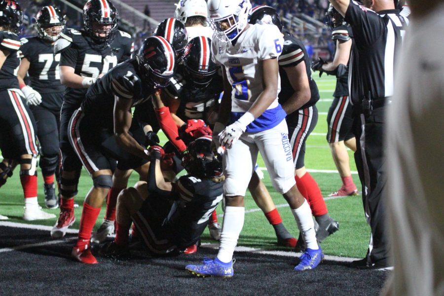 Senior wide receiver no. 11 Omari Murdock and senior tight end no. 21 Lane Droupy help up junior wide receiver no. 2 Jaxson Lavender. Lavender scored two touchdowns and rushed 128 yards.