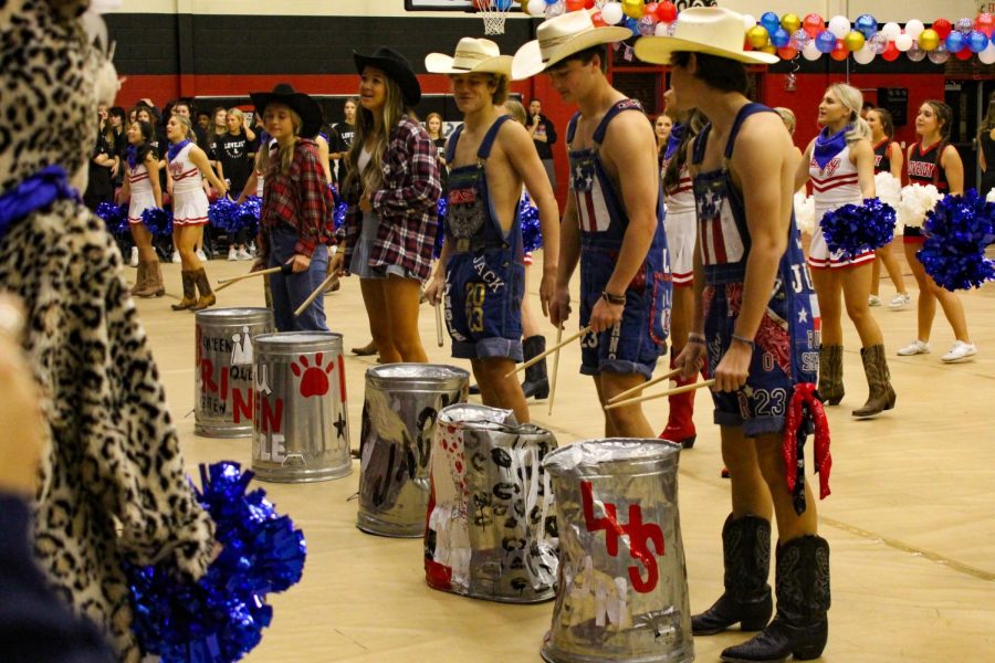 The Dirty Drumline faces the student section and plays their drums. The drumline plays at each home football game.
