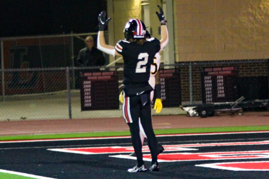 Junior wide receiver no. 2 Jaxson Lavender puts his arms up signaling a touchdown. The score of the game was 77-27.
