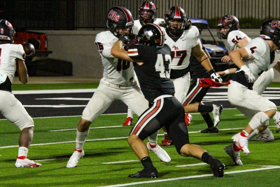 Sophomore outside linebacker no. 43 Chase Bogle defends against Burleson’s senior tight end no. 16. Lovejoy’s defense held Burleson to 99 rushing yards in the game.