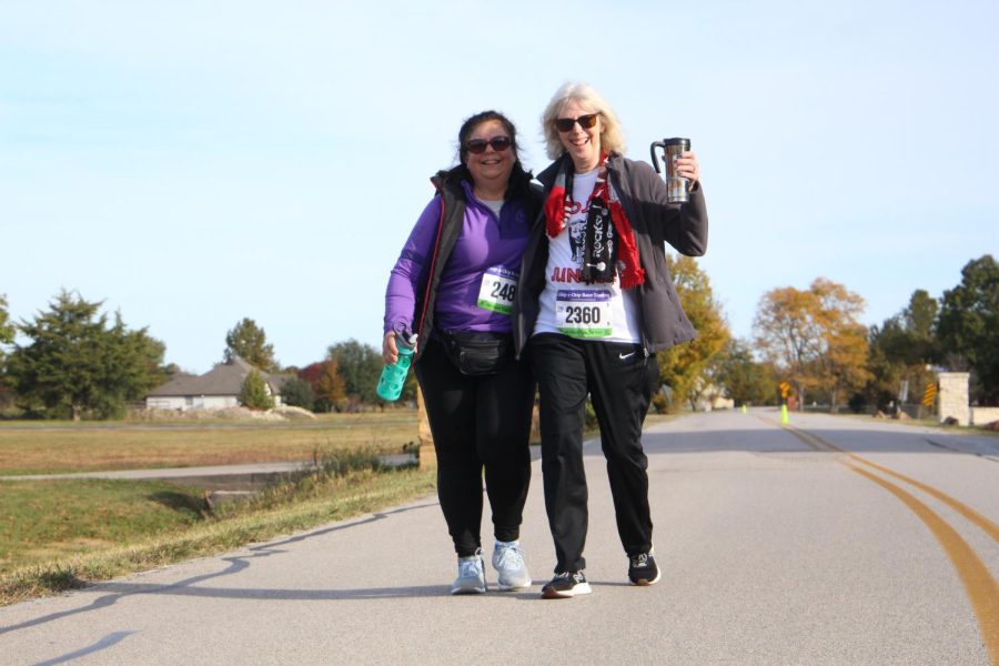 Community members June Sullivan and Louise King walk together at Saturdays race. King ended with an overall time of 54:02.35.