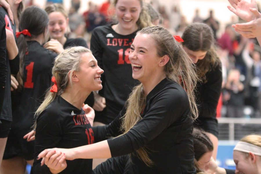 Senior defensive specialist no. 16 Brooklyn Lloyd and senior hitter no. 6 Avery Villareal laugh and hug eachother after winning the regional championship game. Villareal scored the game winning point.