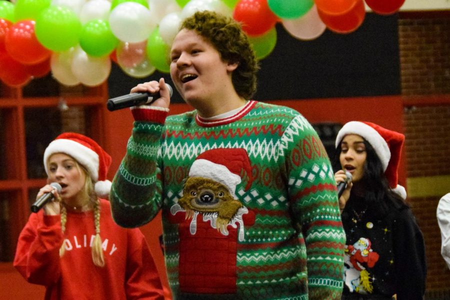 Junior Ryder Sullivan sings with the choirs a cappella group. They sang Rudolf the Red Nose Reindeer.