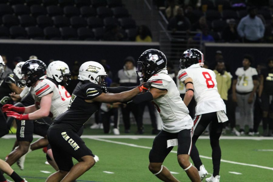 Senior defensive back no. 5 Jayden Chester-Lawton tackles South Oak Cliff’s sophomore wide receiver no. 17 Rickey Evans. Lawton tackled Evans keeping South Oak Cliff at fourth down.