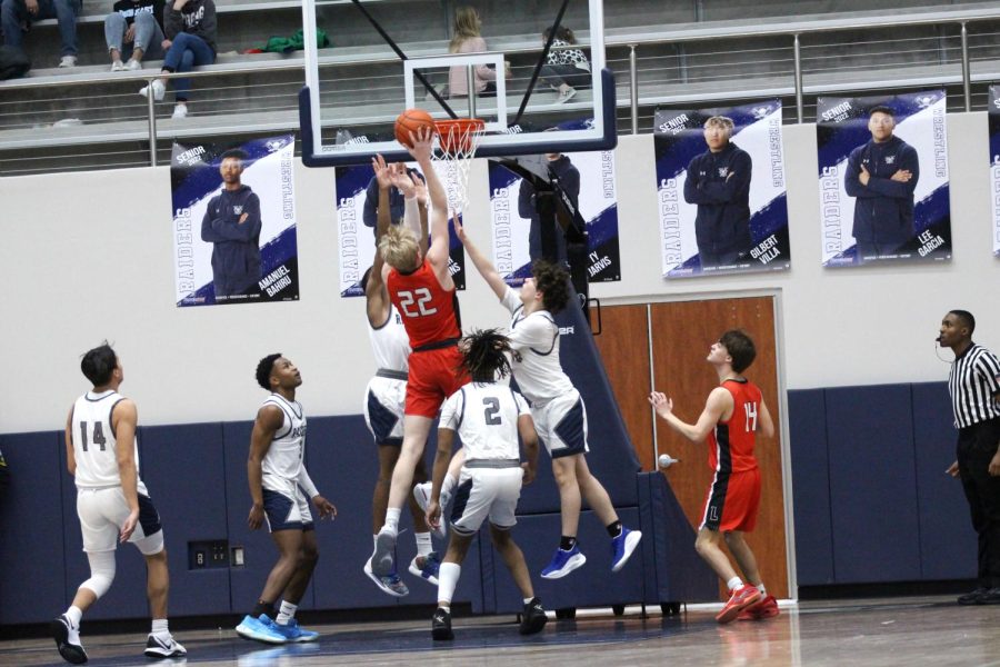 Junior power forward no. 22 Karson Templin drives to the rim in an effort to score. The Leopards scored 14 points in the third quarter. 