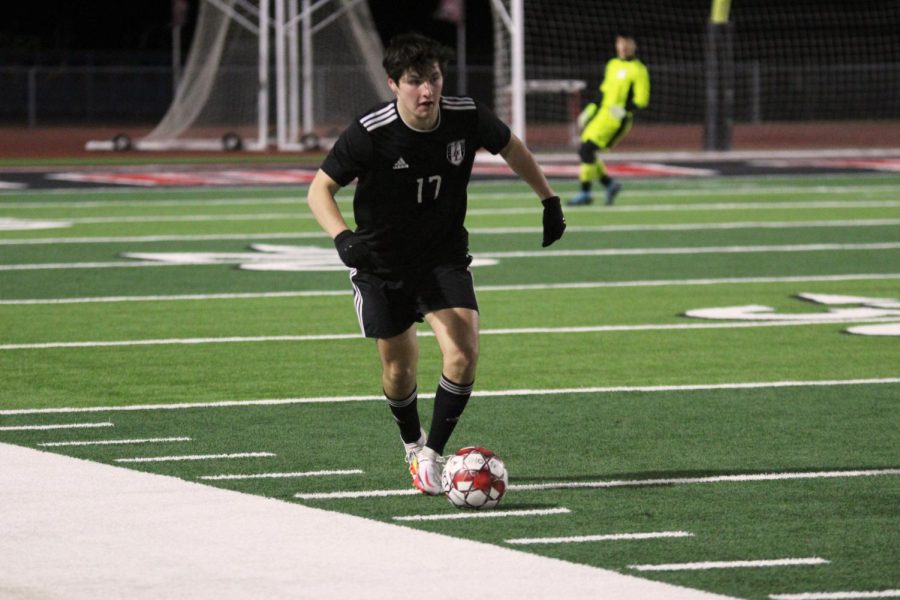 Senior midfielder no. 17 Nico Aguilar looks to pass to a teammate. The game brought the teams win/loss percentage to 37.5%