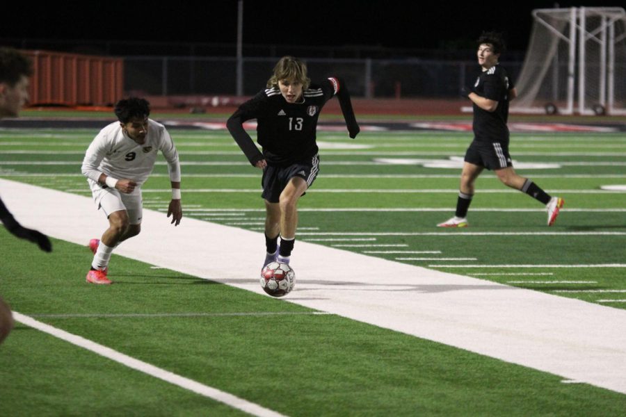 Senior defender no. 13 Chris Dismukes runs to take possession of the ball away from The Colonys no. 9 Oldayir Najera. Tuesdays game brings the boys soccer overall record to 2-4-2.