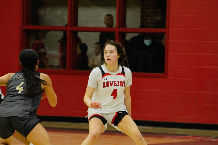 Junior guard no. 4 Sam Basson attempts to block The Colony’s point guard no. 4 Katherine Mejia. The girl’s basketball team will be playing Wylie East away tomorrow.