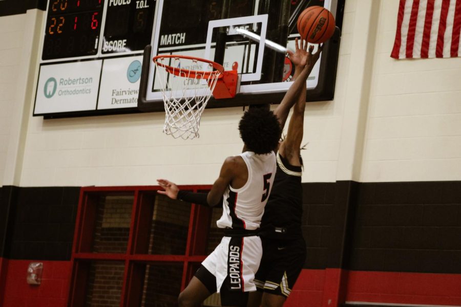 Senior small forward no. 5 Kidus Getenet attempts to tip the ball into the net. Gentenet led the Leopards into a two point lead.