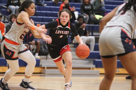 Junior point guard no. 4 Sammie Basson keeps the ball away from McKinney North. The girls basketball team lost their game on Friday with a final score of 40-45.