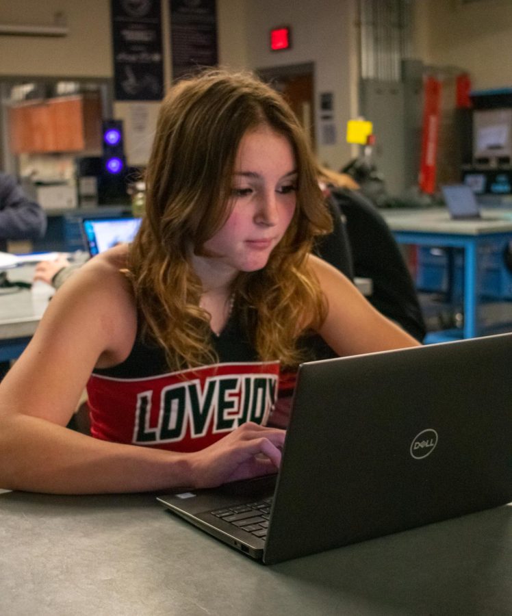 Junior Mackenzie Lang works on her rocket design project for engineering. Lang juggles both cheer and engineering for the high school. The reason Im doing both is because its fun, challenging, and its two things that im passionate about doing in the future, Lang said.

