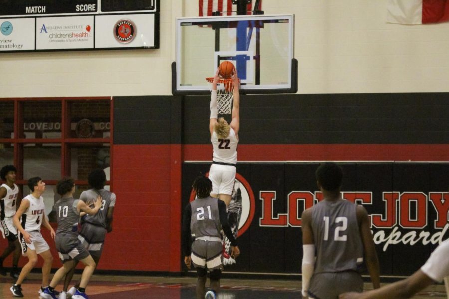 Junior power forward no. 22 Karson Templin dunks the ball. The Leopards were up by seven at the end of the first half. 