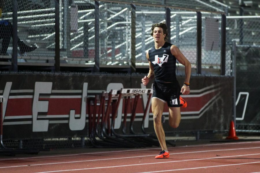 Sophomore sprinter Parker Livingstone runs in the 400-meter race. Livingstone  ran a time of 54.65 seconds.