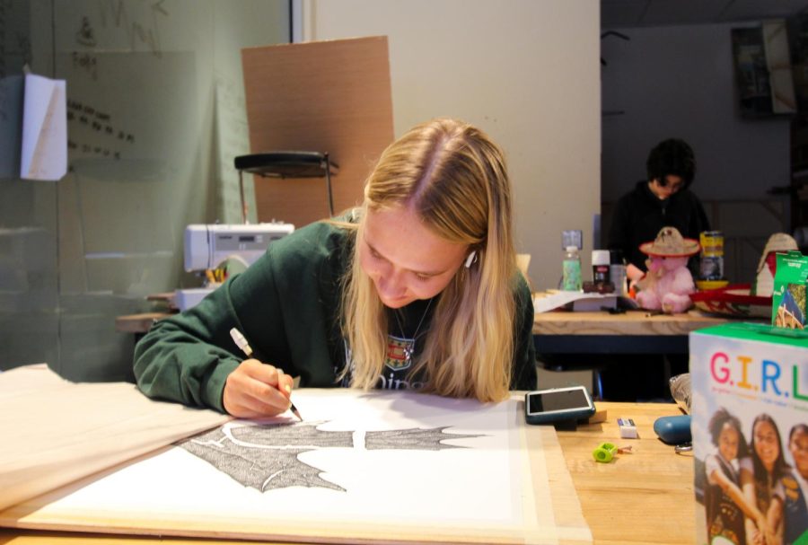 Senior Ella Reaugh works with pen. Reaugh also received a perfect score on the AP exam and a nomination for the US Presidential Scholar in the Arts award.