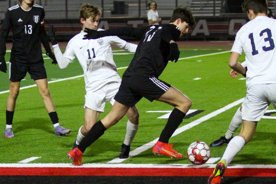 Junior no. 23 Connor Nowak brings the ball up the field. The Leopards are ranked fourth in district.
