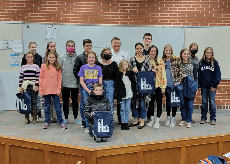 The 4-H Legacy Club stands with their guest speaker, mayor of Lucas Jim Olk. The club meets every fourth monday of the month.