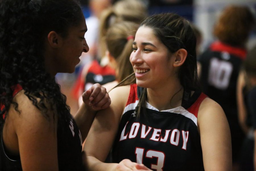 Junior point guard no. 13 Annalysa Ritchie and sophomore Samantha Daniels talk after the game. The Leopards final score was 41-11.