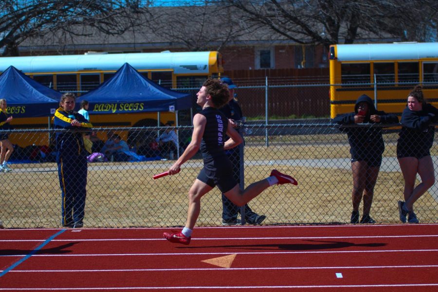 Sophomore sprinter Wes Hightower runs in the 4x100 meter relay. The team ran the race in 46.44 seconds.