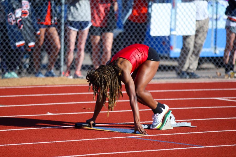 Junior sprinter Leila Ngapout gets set for the sprint medley relay. Ngapout placed third in the 100 meter dash, running the race in 12.58 seconds.