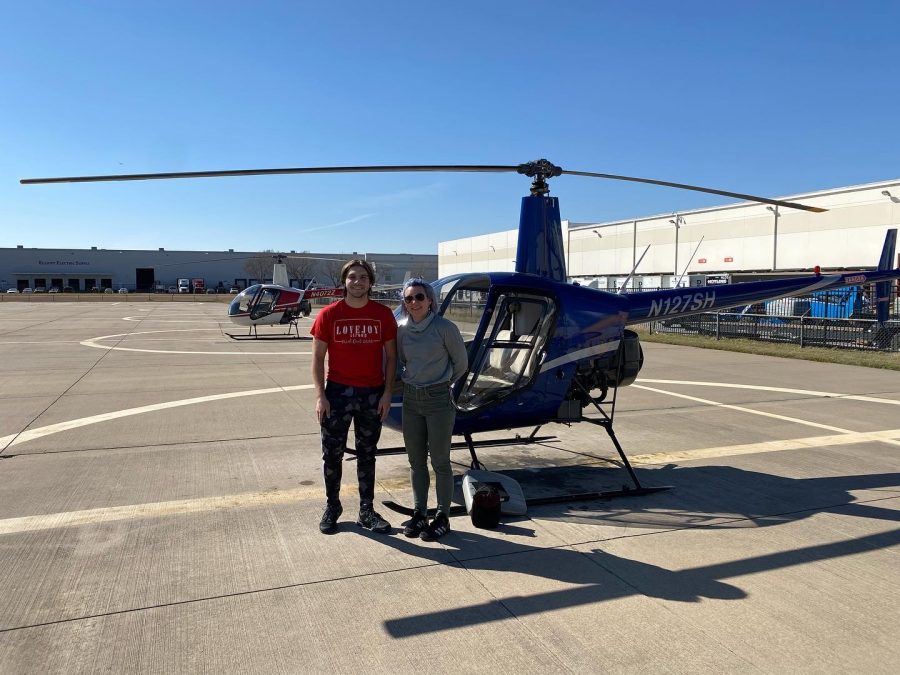 Mathias Alling stands with his flight instructor Sierra. Mathias and Sierra flew a Robinson R22 helicopter on March 10.
