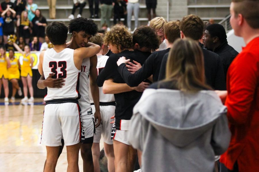 Junior forward no. 10 Parker Patel hugs senior forward no. 5 Kidus Getenet when he came off the court. The team was recognized with the district coaching staff of the year. 