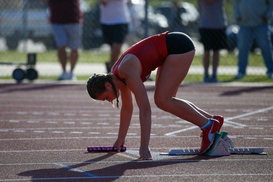 Junior Chloe Schaeffer is in the blocks of the 4x100 relay. The 4x100 team qualified for area.