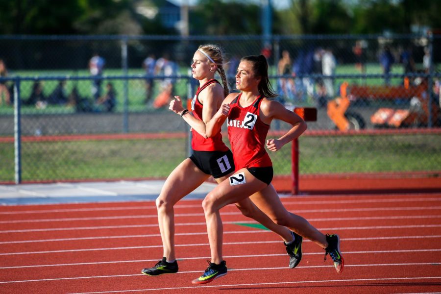 Sophomore Kailey Littlefield and junior Amy Morefield go stride for stride in the opening lap of the 800. Littlefield won the race with a time of 2:19.00.