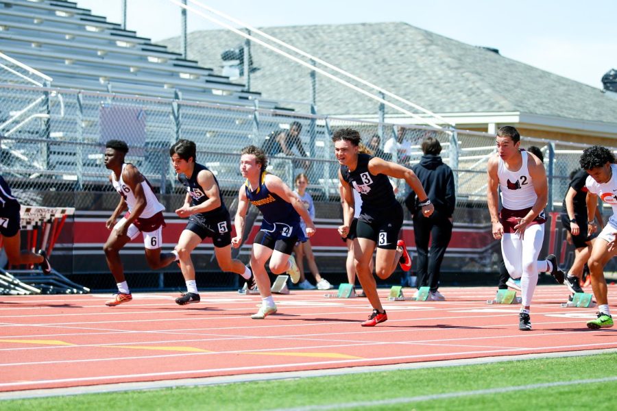 Sophomore Avery Fuller runs in the 100 meter dash. Fuller ran the race in 11.98 seconds.
