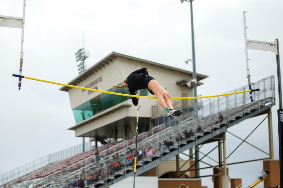 Sophomore Brinley Ludlow goes over the vault. Ludlow qualified for region at a height of 86.