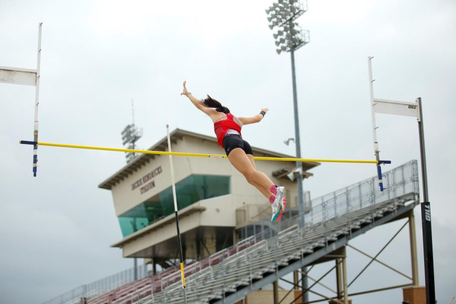 Junior Sarah Salsgiver competes in pole vault. Salsgiver placed third at a height of 106.