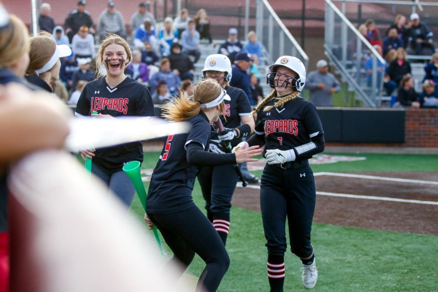 Sophomore short stop no. 5 Skylar Rucker celebrates junior pitcher no. 7 Jade Owens run to home plate. The Leopards will play in the bi-district round against Frisco Heritage.