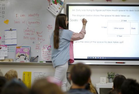 Fourth grade teacher Kate Duncan teaches her class math. Duncan was a finalist for the presidential award for excellence in math and science teaching in the state of Texas.