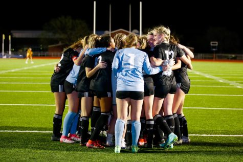 The girls soccer team hugs it out after second round loss. The team was defeated by the White Longhorns 1-0.